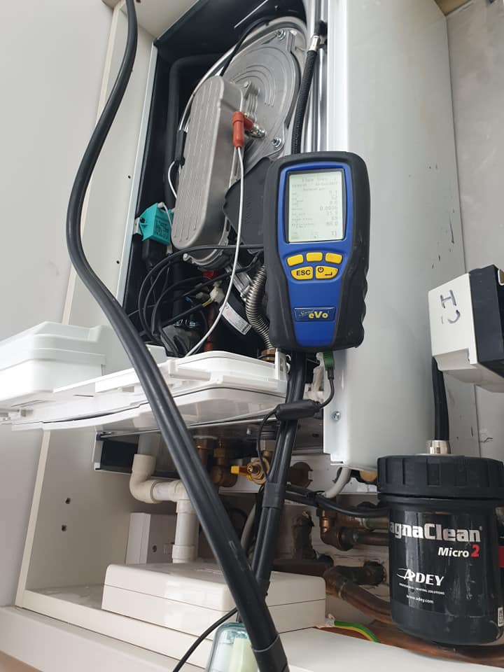 Flue gas analyser connected to a boiler beside a magnetic filter