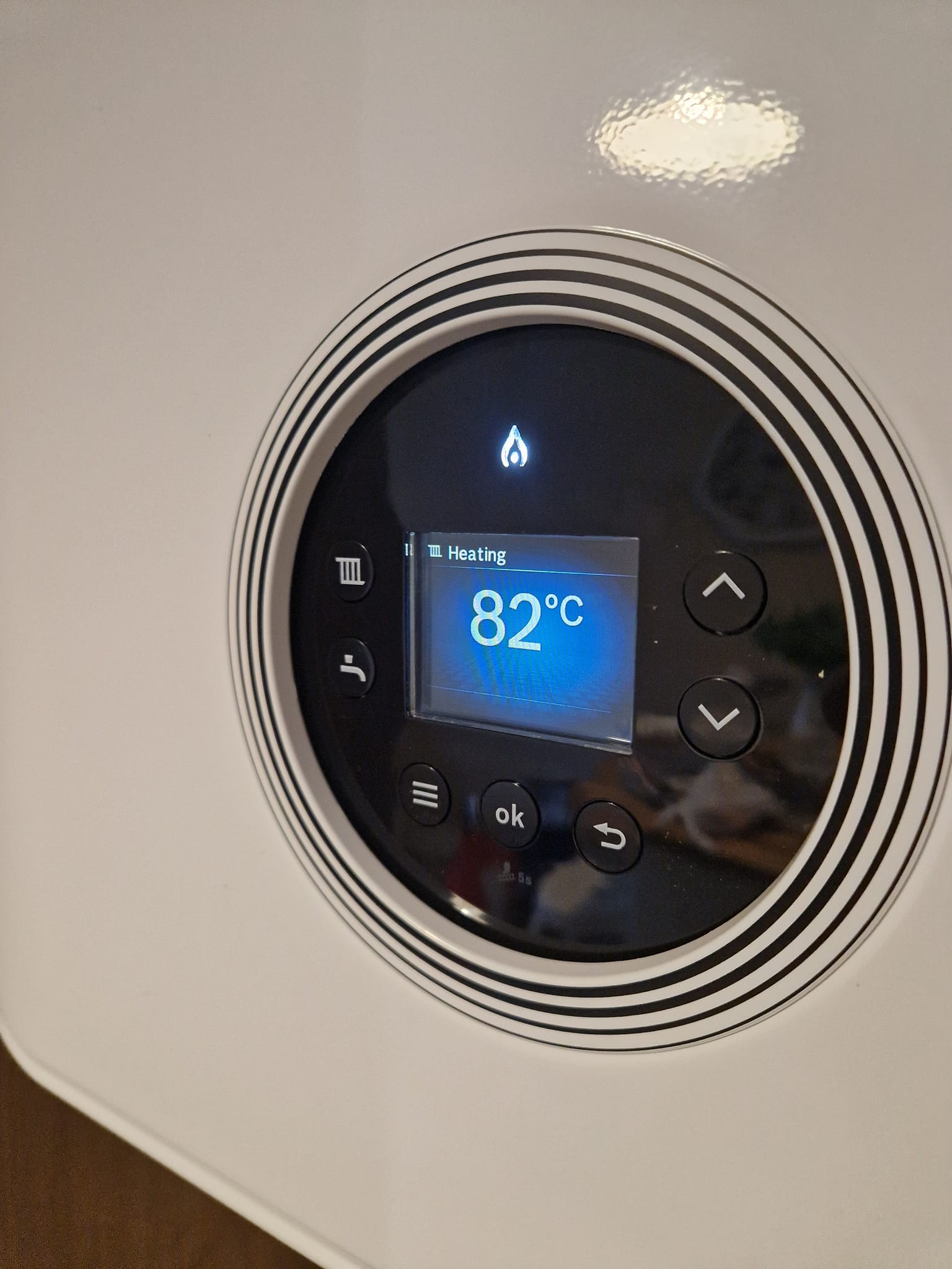 Boiler control panel showing a heating temperature of 82 degrees